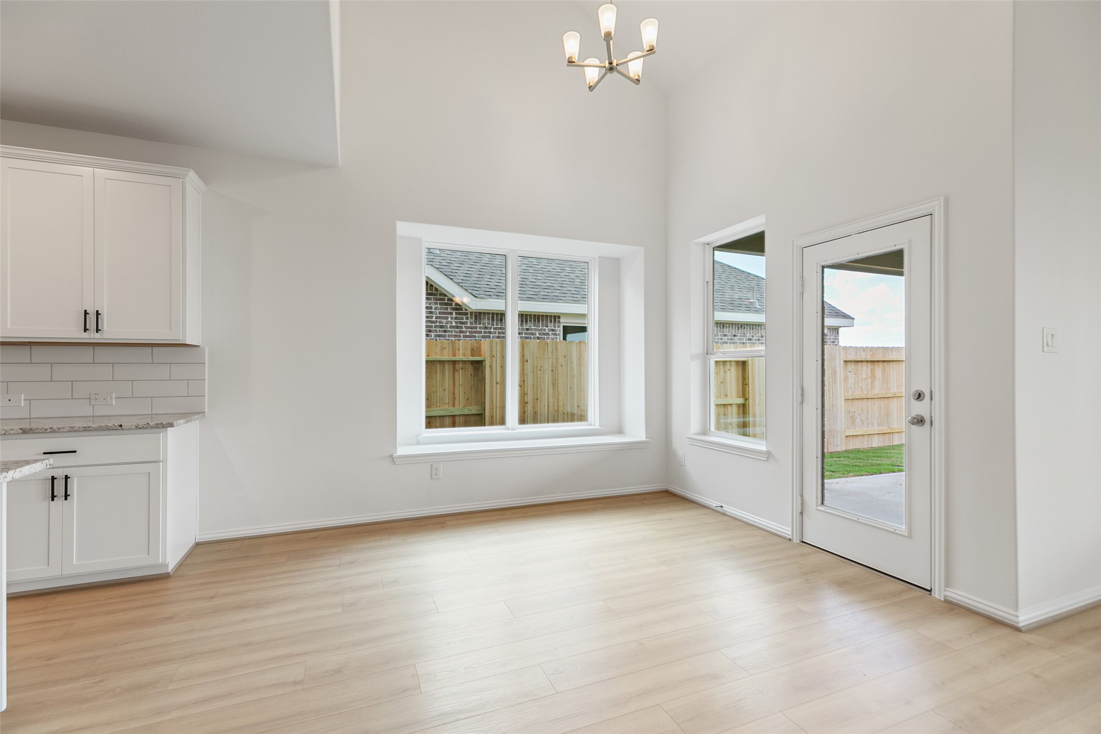 2805 Ruby Laurel Drive Iowa Colony, TX 77583 - Photo 17 of 39 an empty room with windows and ceiling fan