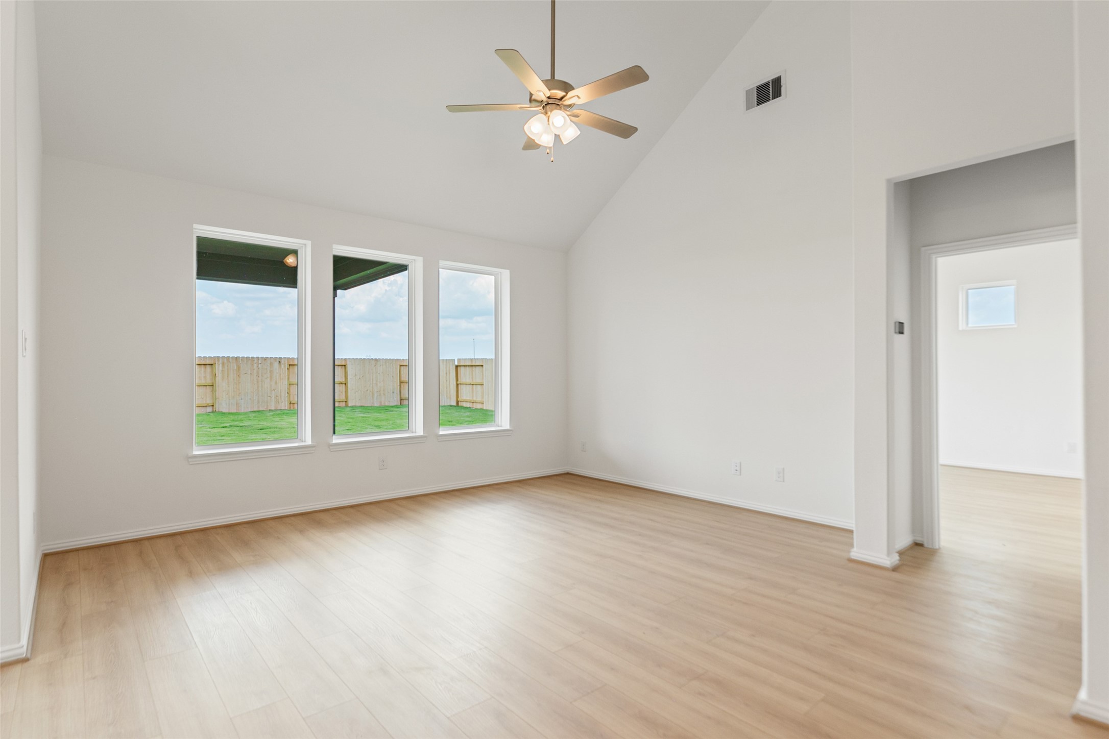 2805 Ruby Laurel Drive Iowa Colony, TX 77583 - Photo 18 of 39 wooden floor in an empty room with a window