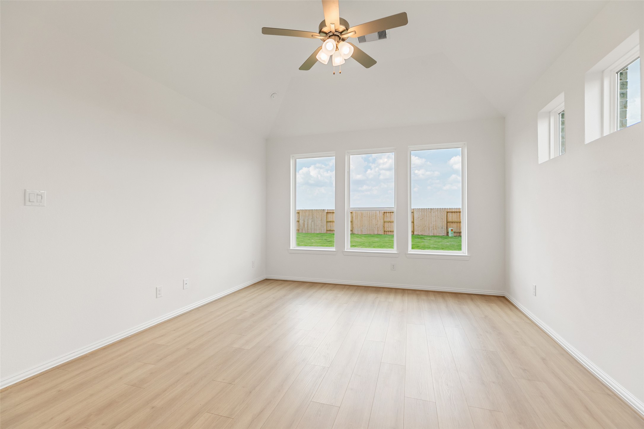 2805 Ruby Laurel Drive Iowa Colony, TX 77583 - Photo 21 of 39 an empty room with wooden floor and windows