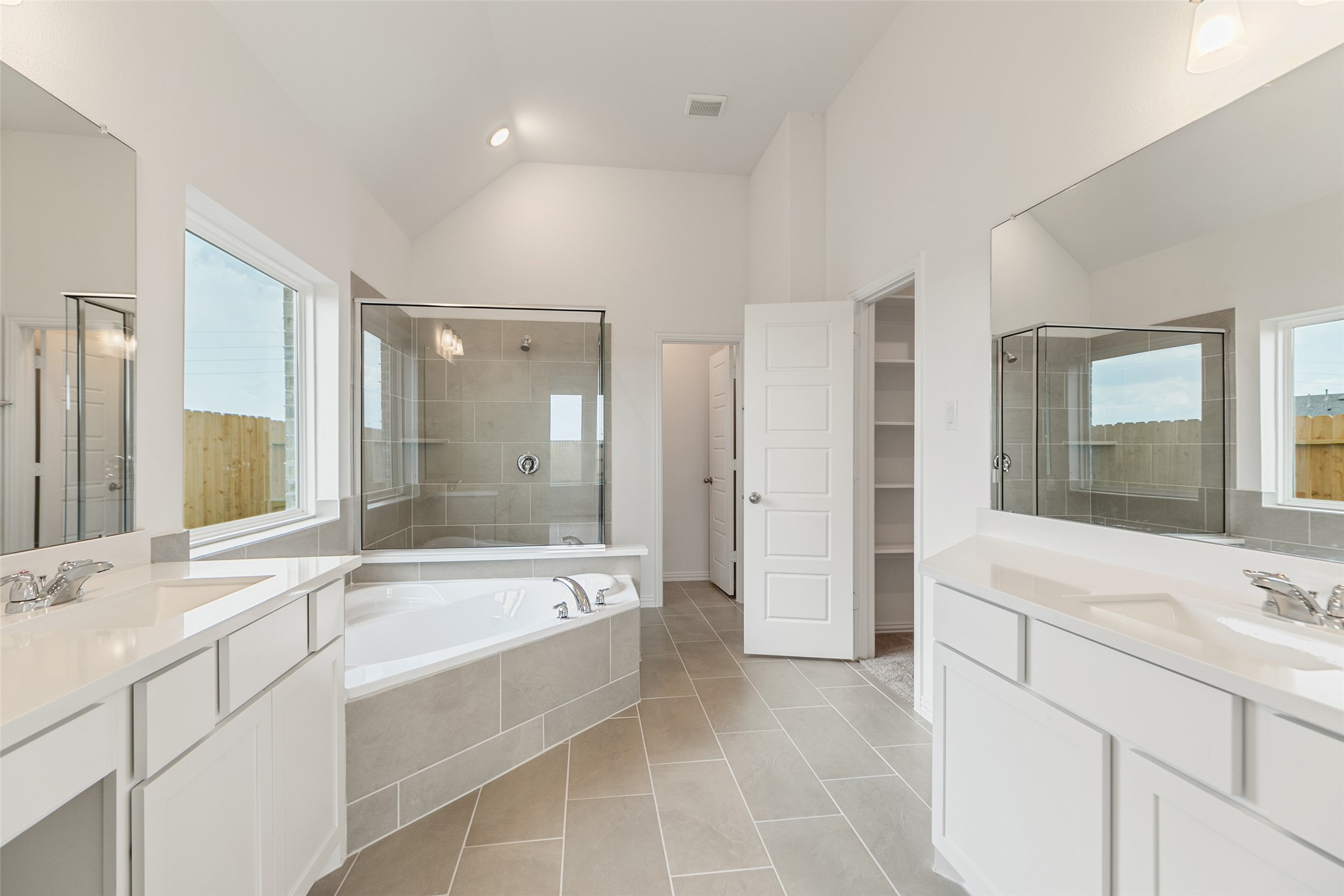 2805 Ruby Laurel Drive Iowa Colony, TX 77583 - Photo 23 of 39 a bathroom with a bathtub shower sink and mirror