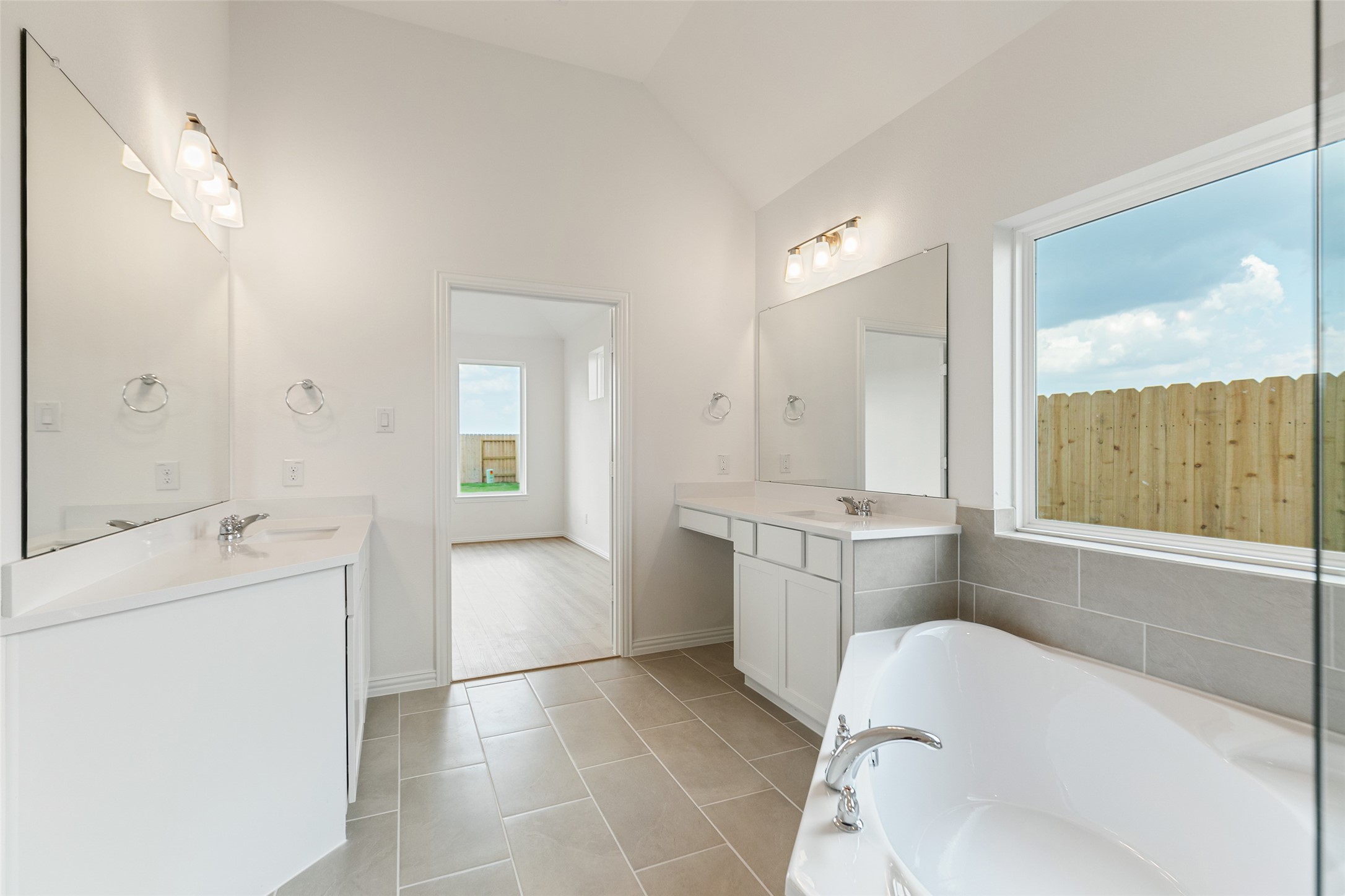 2805 Ruby Laurel Drive Iowa Colony, TX 77583 - Photo 25 of 39 a bathroom with a tub sink and mirror
