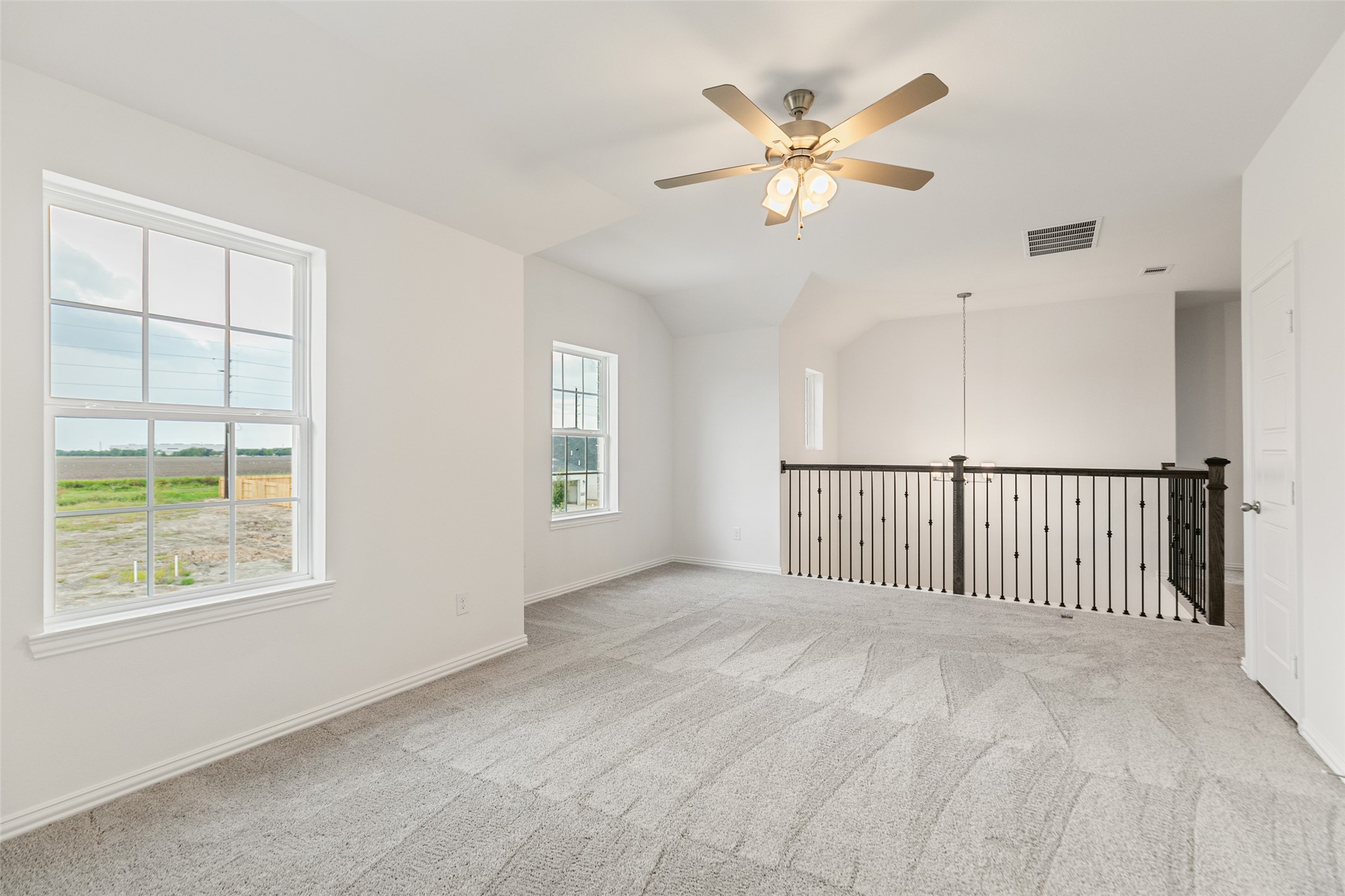 2805 Ruby Laurel Drive Iowa Colony, TX 77583 - Photo 29 of 39 an empty room with fan and windows