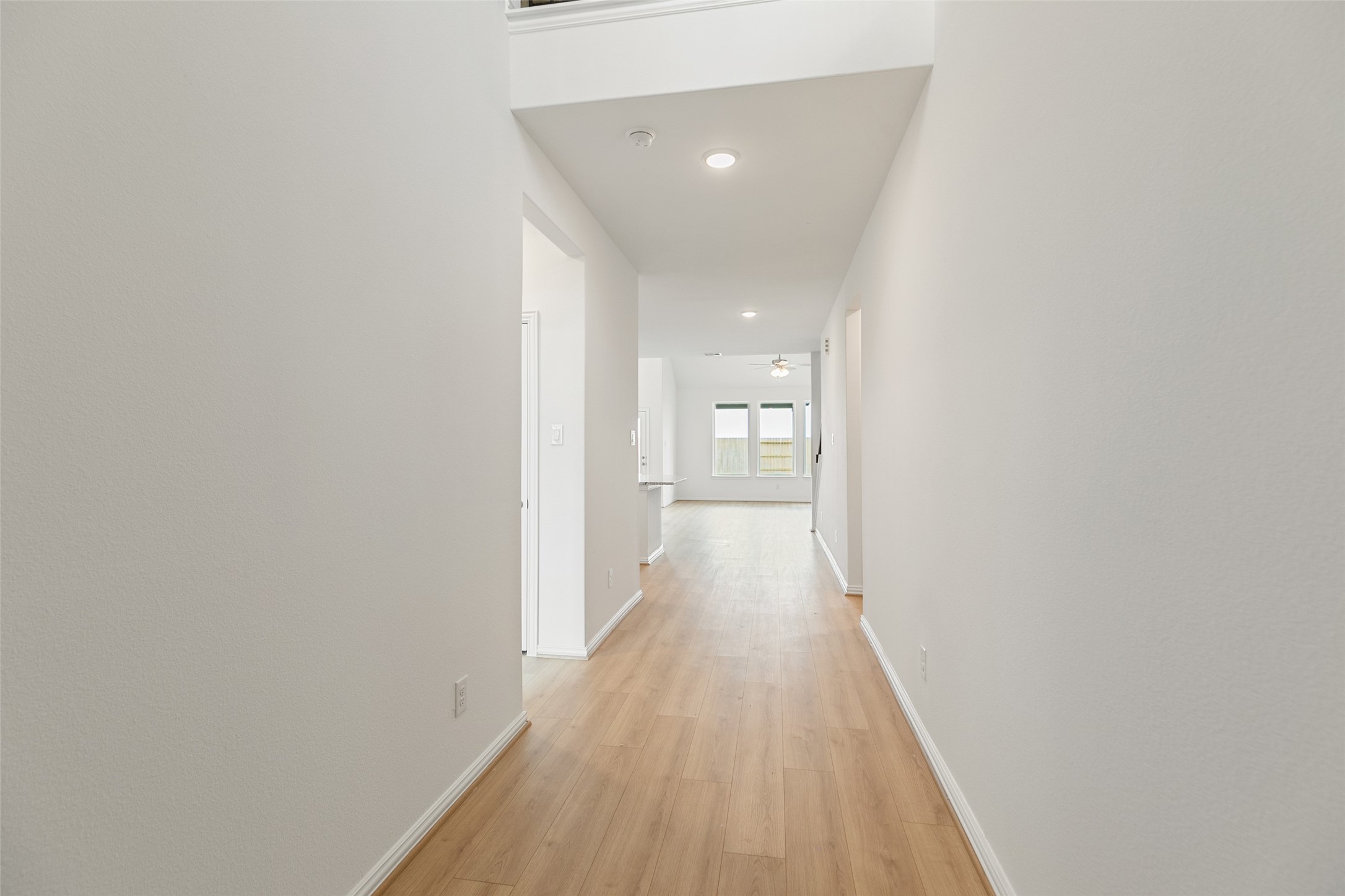 2805 Ruby Laurel Drive Iowa Colony, TX 77583 - Photo 5 of 39 a view of a hallway with wooden floor