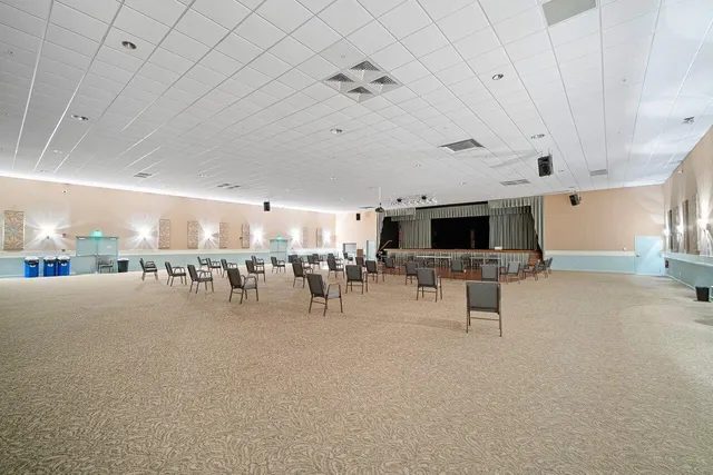 a view of a dining room with furniture wooden floor and chandelier