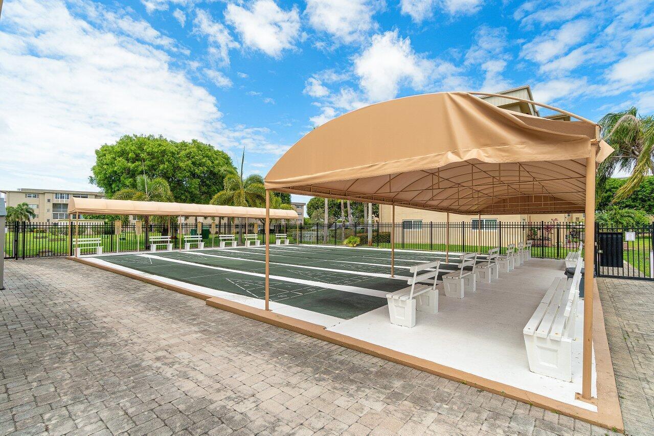 2615 Northeast 1st Court, Unit 301 Boynton Beach, FL 33435 - Photo 35 of 40 swimming pool view with a seating space