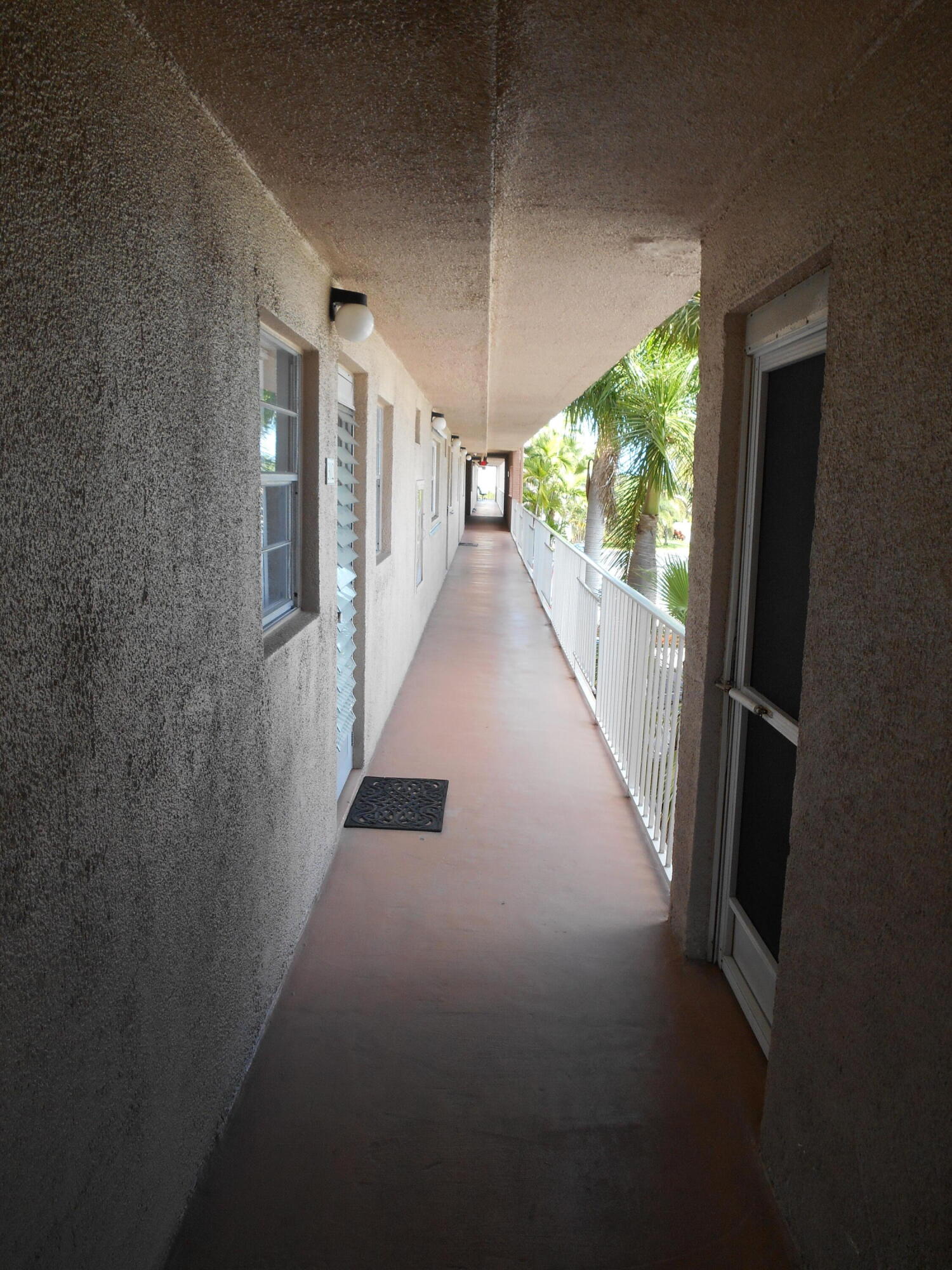 2615 Northeast 1st Court, Unit 301 Boynton Beach, FL 33435 - Photo 39 of 40 a view of hallway with stairs