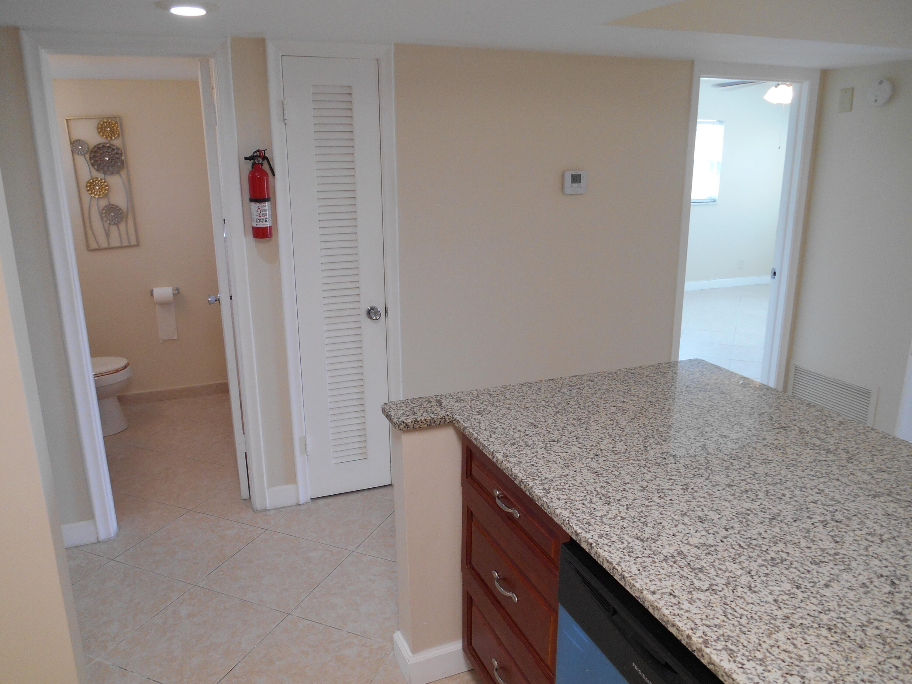 2615 Northeast 1st Court, Unit 301 Boynton Beach, FL 33435 - Photo 6 of 40 a view of vanity and hallway