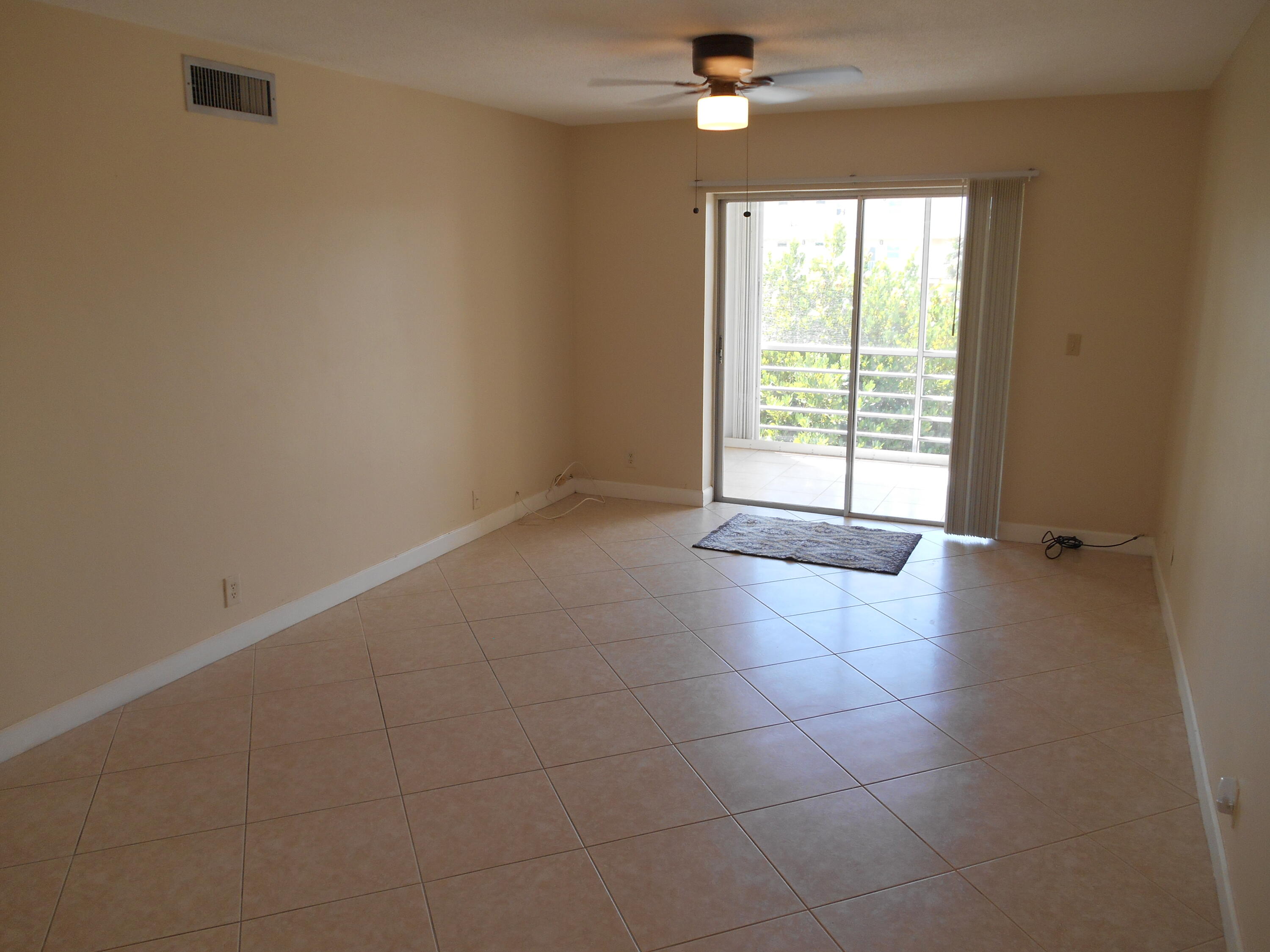 2615 Northeast 1st Court, Unit 301 Boynton Beach, FL 33435 - Photo 10 of 40 a view of an empty room with a window