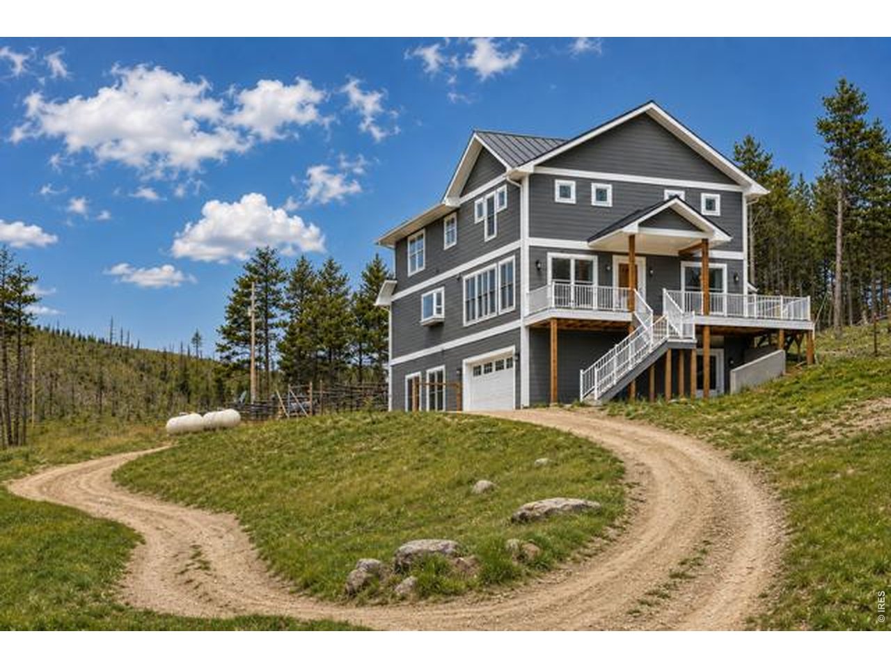 2051 Stove Prairie Road Bellvue, CO 80512 - Photo 48 of 50 Imagine the home in this color. AI generated image