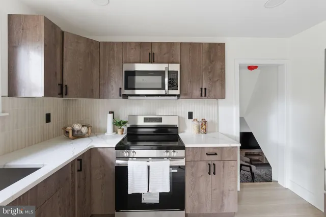 a kitchen with a sink and cabinets