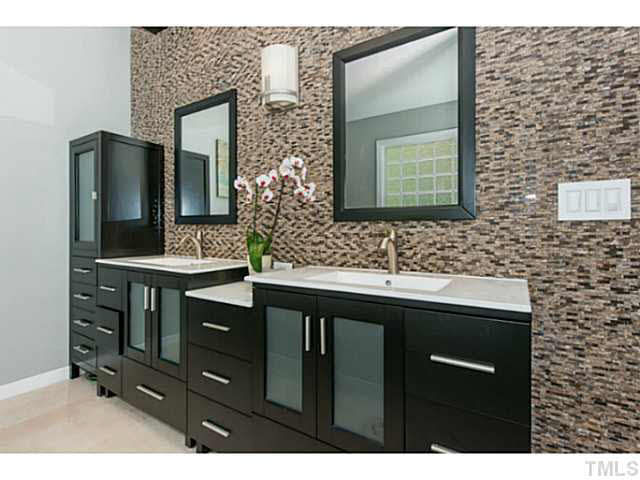 1205 Red Brick Road Garner, NC 27529 - Photo 11 of 19 a bathroom with a sink and a mirror