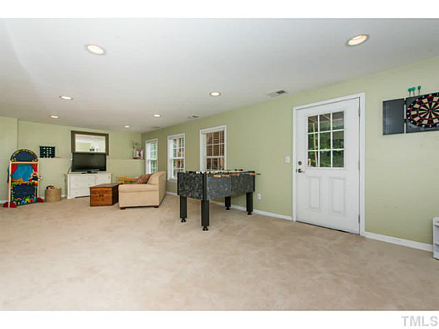 1205 Red Brick Road Garner, NC 27529 - Photo 14 of 19 a living room with furniture and a table