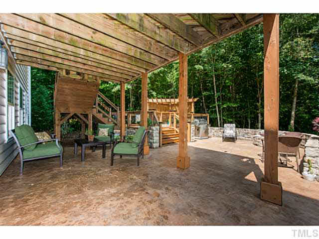 1205 Red Brick Road Garner, NC 27529 - Photo 16 of 19 a view of a patio with a table and chairs
