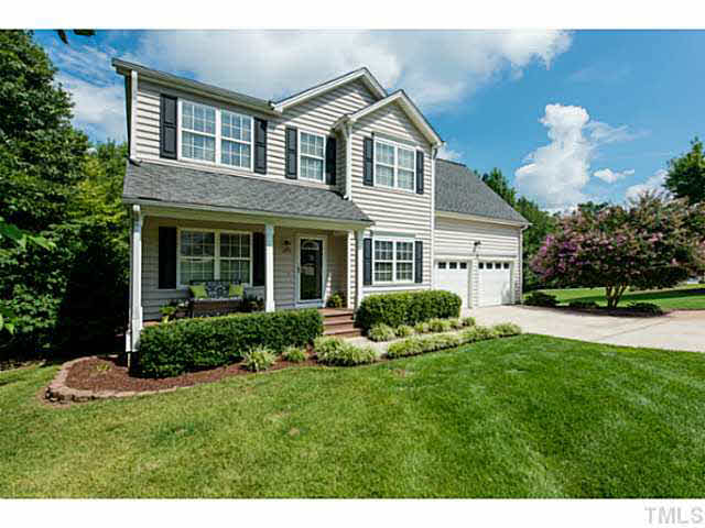 1205 Red Brick Road Garner, NC 27529 - Photo 19 of 19 a front view of a house with a yard and garage