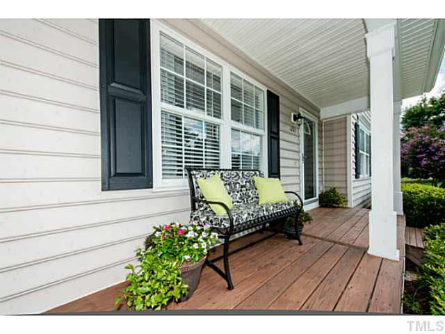 1205 Red Brick Road Garner, NC 27529 - Photo 2 of 19 a view of a house with wooden bench in patio