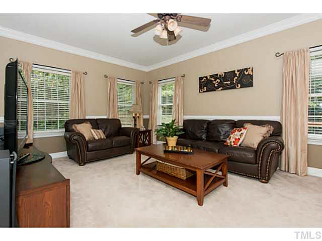 1205 Red Brick Road Garner, NC 27529 - Photo 8 of 19 a living room with furniture and a flat screen tv