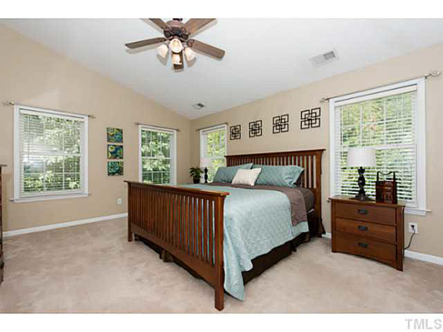 1205 Red Brick Road Garner, NC 27529 - Photo 10 of 19 a bedroom with a bed and window