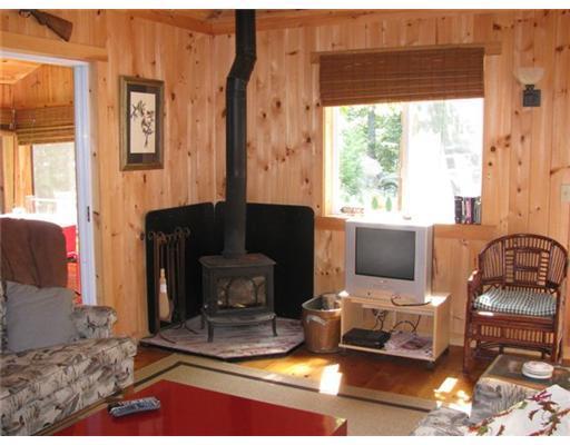 89 Lower Road Lakeville, ME 04487 - Photo 8 of 25 Living Room. Heart warming woodstove....