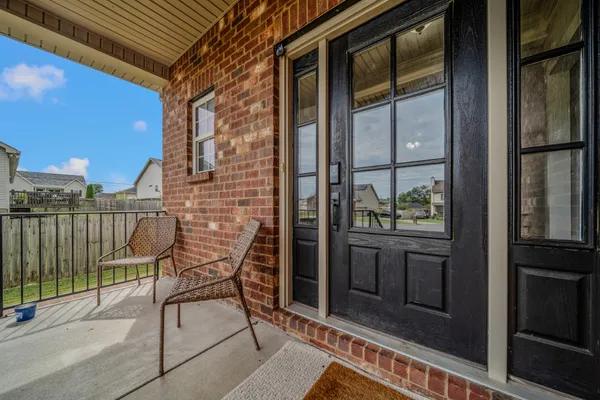 a view of balcony with furniture