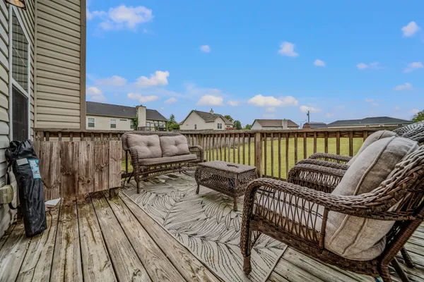 a view of balcony with furniture