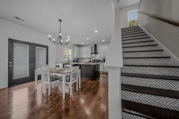 a kitchen with a table and chairs