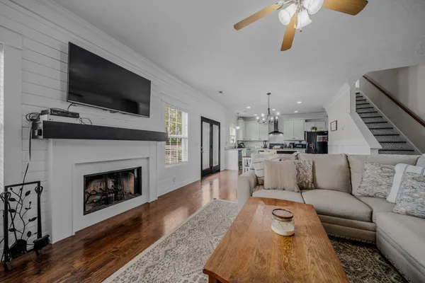 a living room with furniture and a fireplace