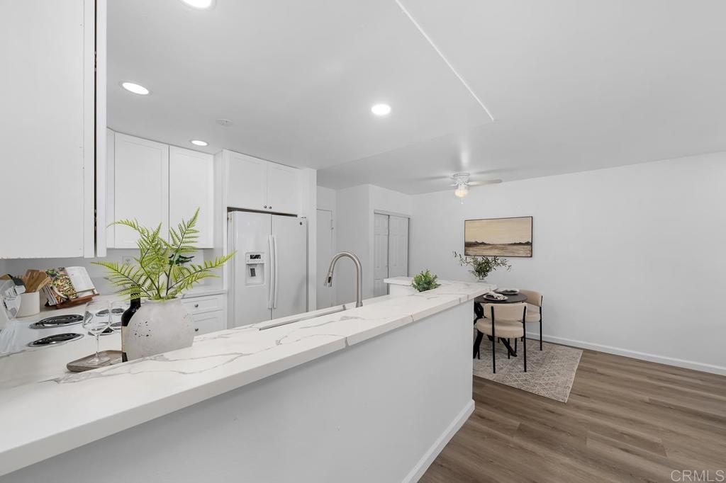 6131 Rancho Mission Road, Unit 211 San Diego, CA 92108 - Photo 12 of 21 a bathroom with a double vanity sink and a mirror