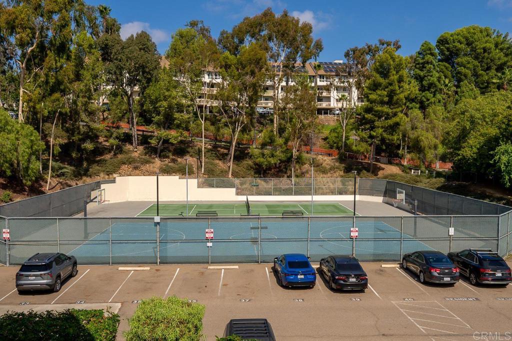 6131 Rancho Mission Road, Unit 211 San Diego, CA 92108 - Photo 21 of 21 a cars parked in front of a building