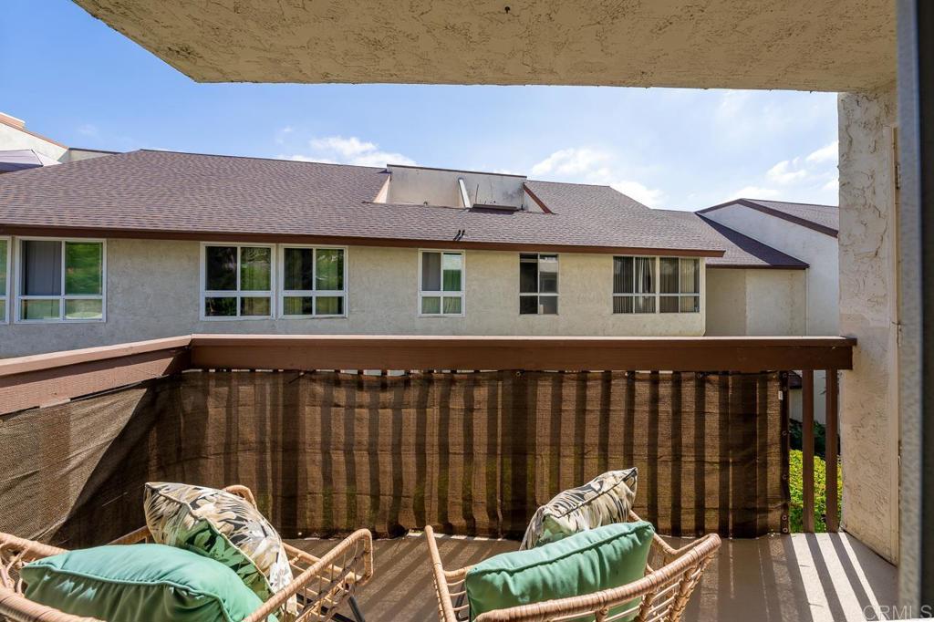 6131 Rancho Mission Road, Unit 211 San Diego, CA 92108 - Photo 5 of 21 a view of deck with chairs and wooden floor