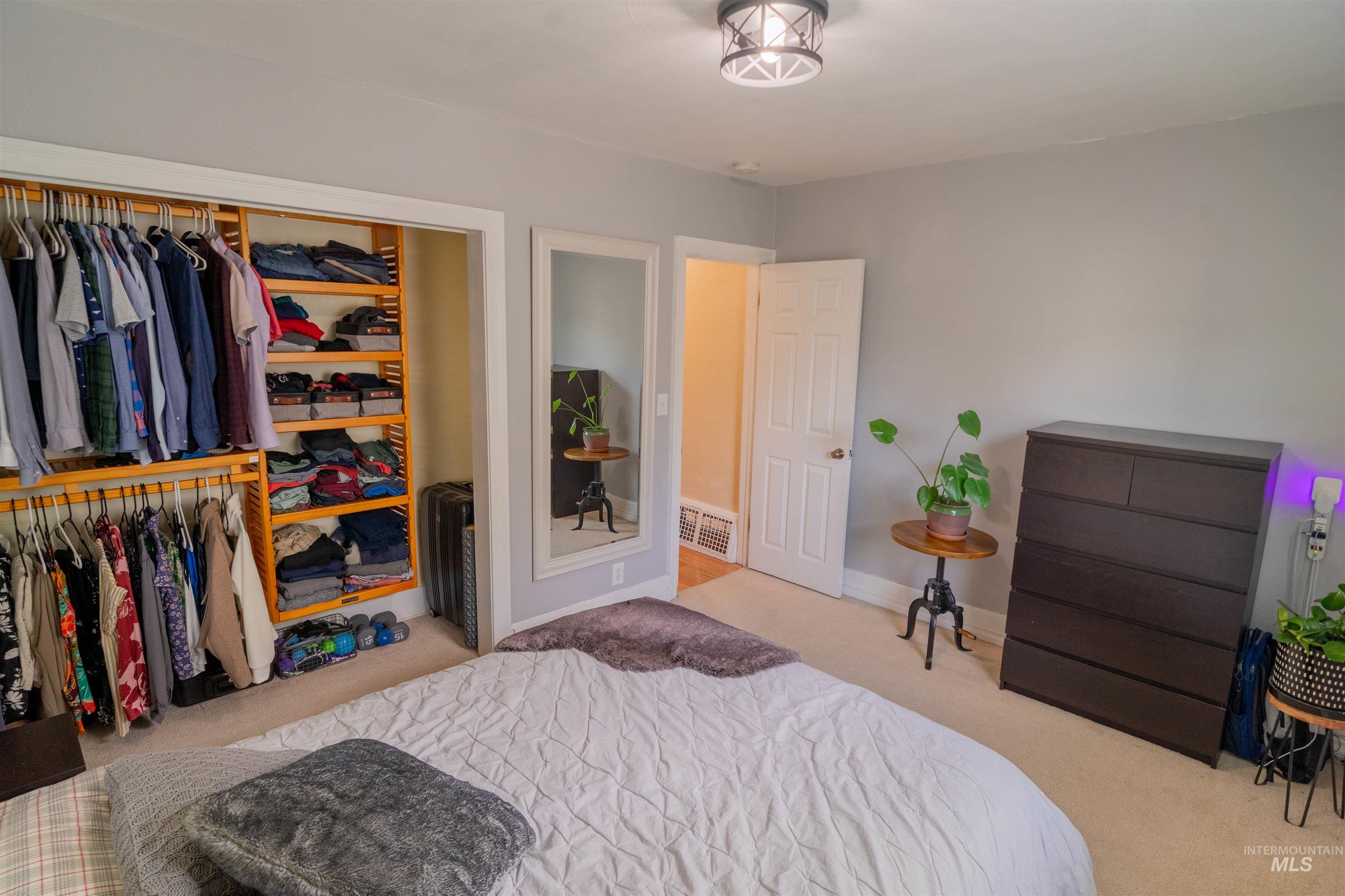 1212 14th Street Lewiston, ID 83501 - Photo 17 of 50 Bedroom with light colored carpet and a closet