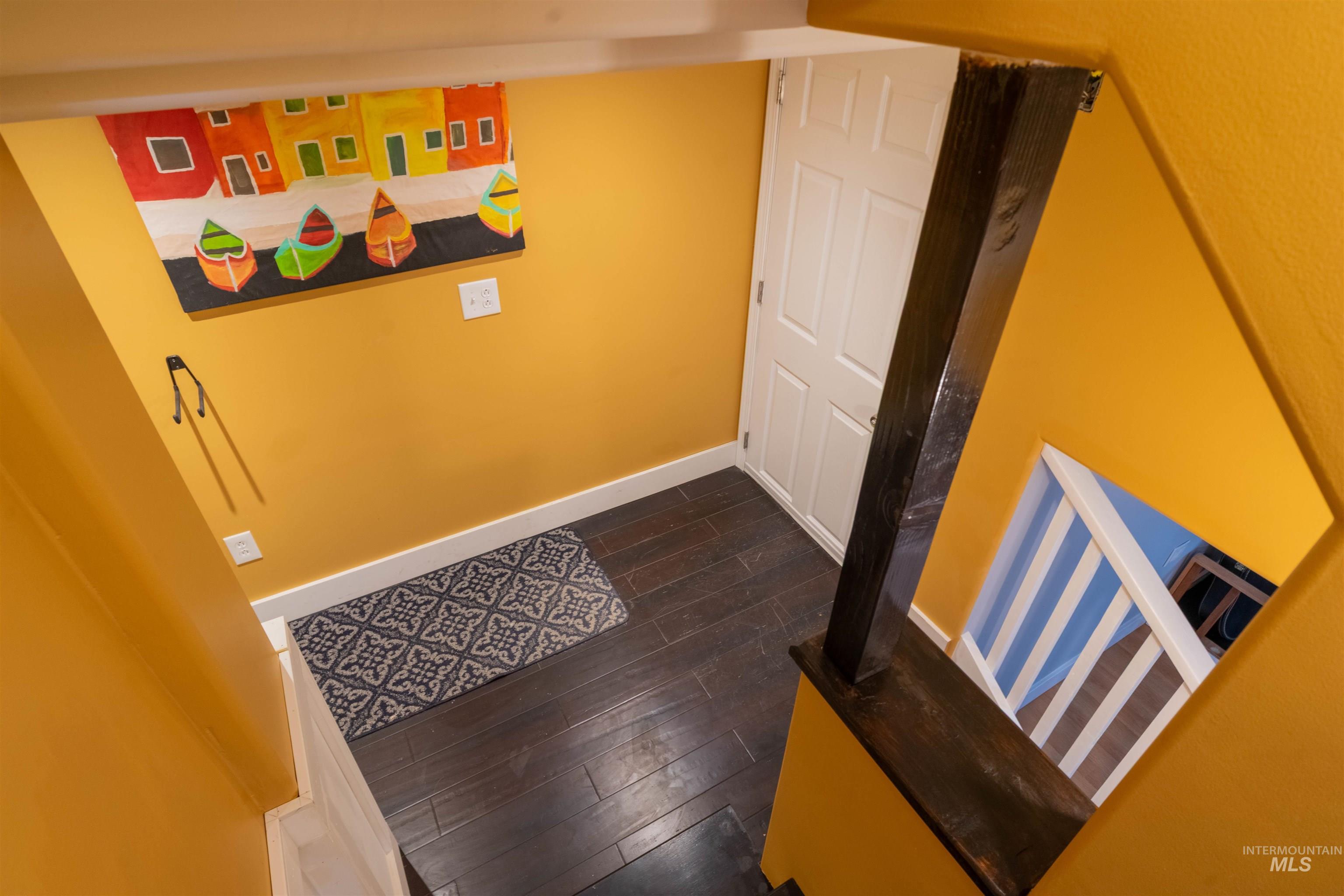 1212 14th Street Lewiston, ID 83501 - Photo 26 of 50 Corridor with dark wood-style flooring and baseboards