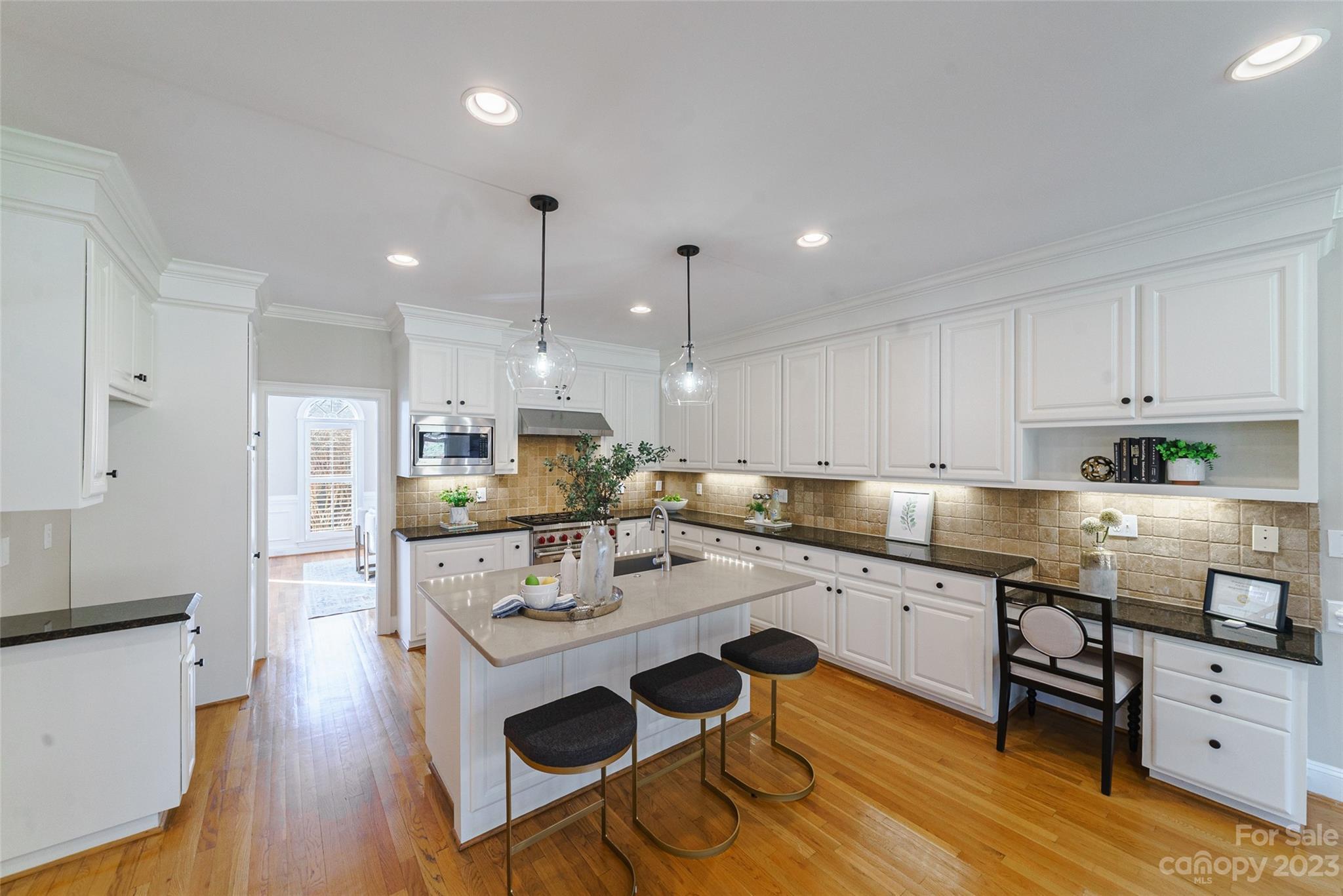 2134 Glade Hill Road Charlotte, NC 28270 - Photo 13 of 48 a kitchen with a sink a counter top space stainless steel appliances and cabinets