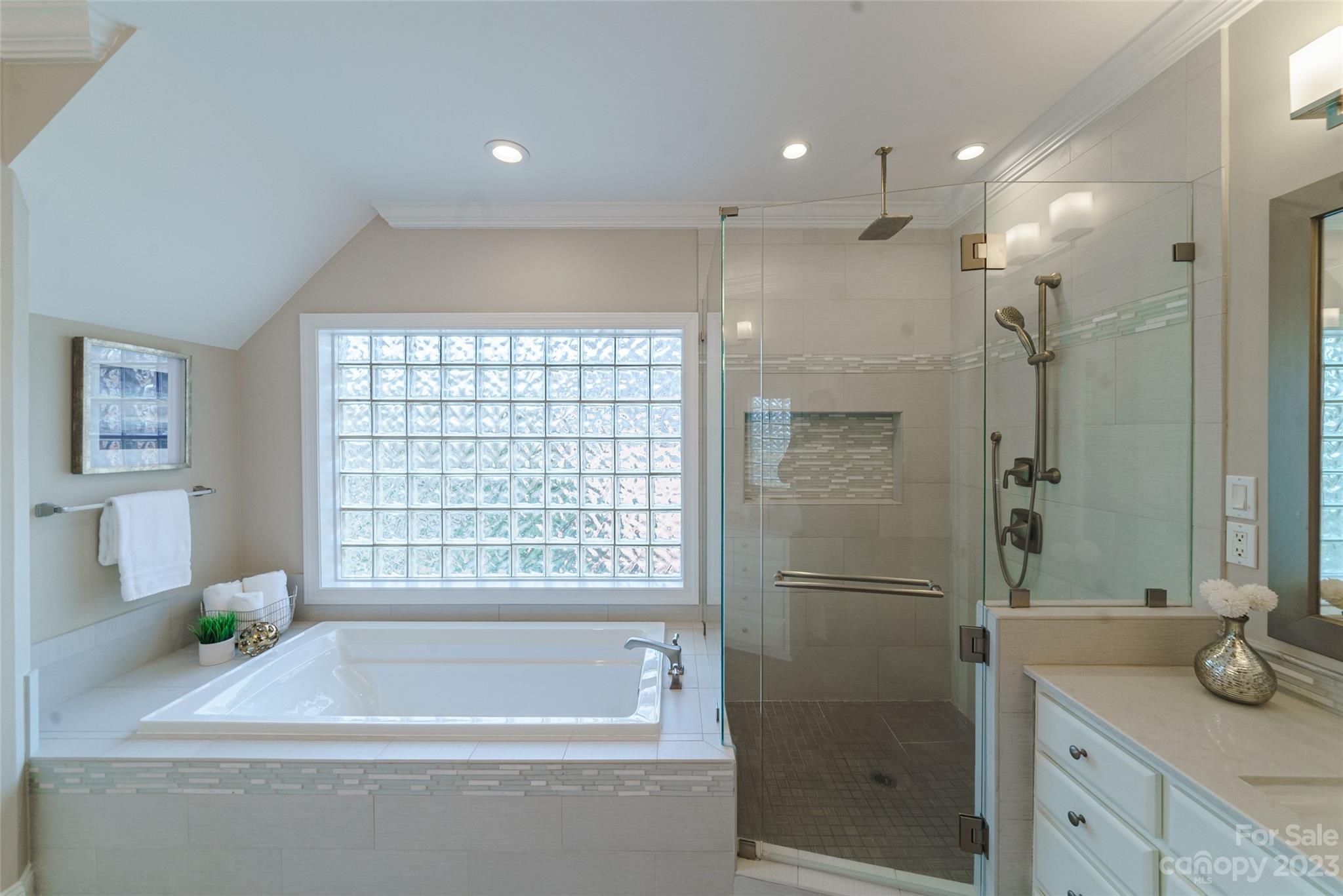 2134 Glade Hill Road Charlotte, NC 28270 - Photo 25 of 48 a bathroom with a bathtub and a shower