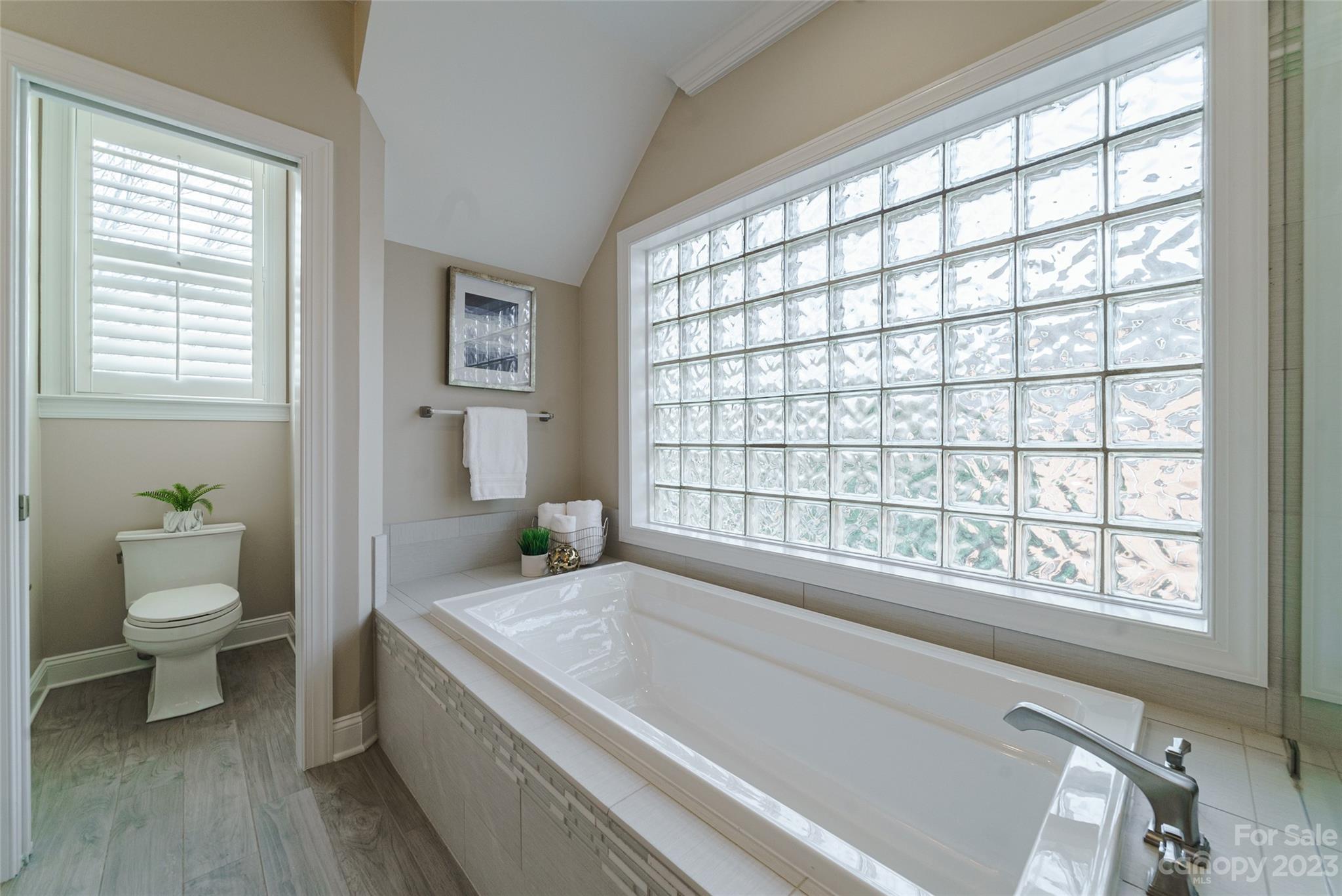 2134 Glade Hill Road Charlotte, NC 28270 - Photo 27 of 48 a bathroom with a granite countertop sink a toilet and a window