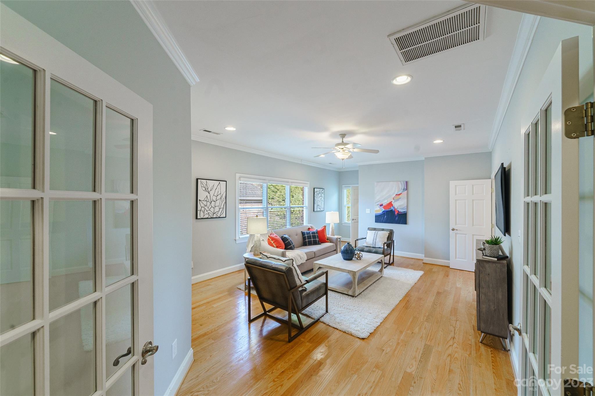 2134 Glade Hill Road Charlotte, NC 28270 - Photo 31 of 48 a living room with furniture and a wooden floor