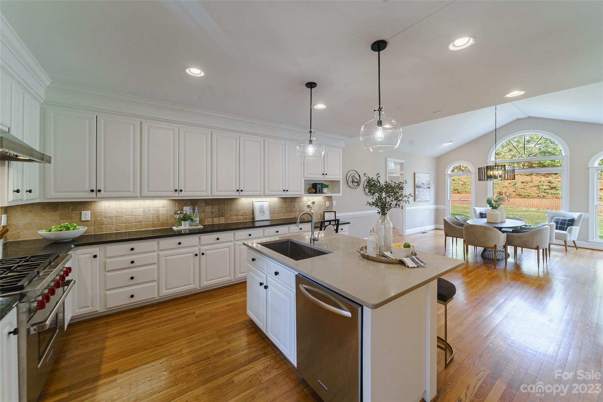 2134 Glade Hill Road Charlotte, NC 28270 - Photo 6 of 48 a kitchen that has a lot of cabinets in it with granite countertop stainless steel appliances