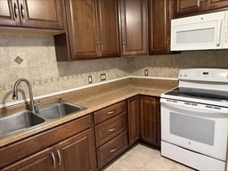 176 Maple Avenue, Unit 3 25 Rutland, MA 01543 - Photo 3 of 16 a kitchen with a sink cabinets and stainless steel appliances