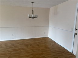 176 Maple Avenue, Unit 3 25 Rutland, MA 01543 - Photo 5 of 16 a view of a room with wooden floor and white doors