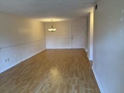 176 Maple Avenue, Unit 3 25 Rutland, MA 01543 - Photo 7 of 16 en empty room with wooden floor