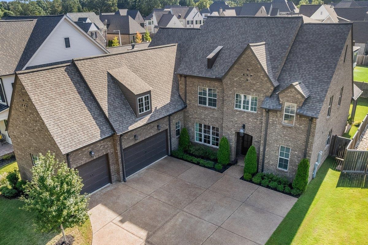 3358 Hidden Bend Lane Collierville, TN 38017 - Photo 1 of 32 an aerial view of a house with swimming pool