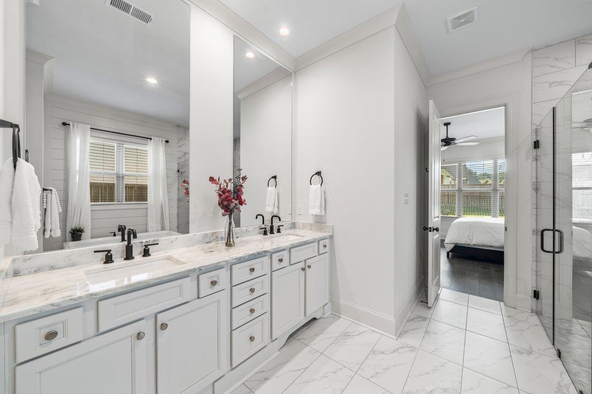 3358 Hidden Bend Lane Collierville, TN 38017 - Photo 20 of 32 a en suite bathroom with a double sink and mirror