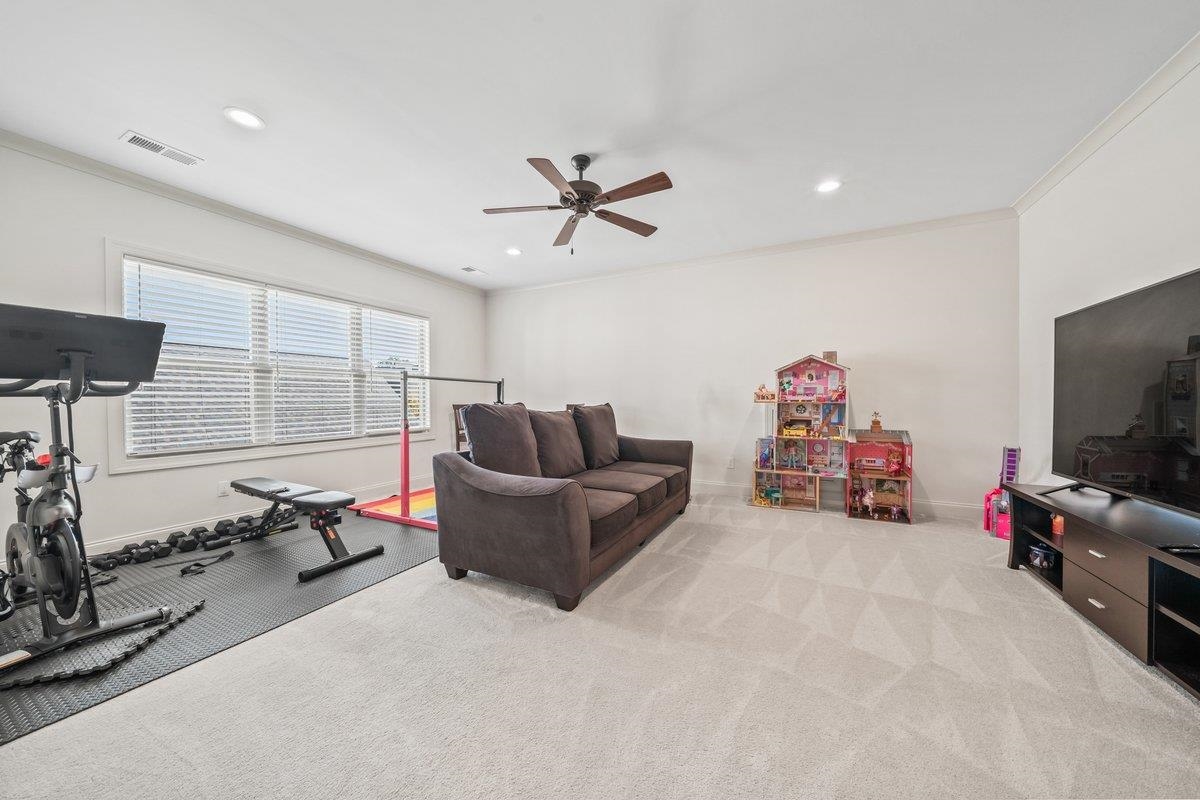 3358 Hidden Bend Lane Collierville, TN 38017 - Photo 24 of 32 a living room with furniture and a flat screen tv