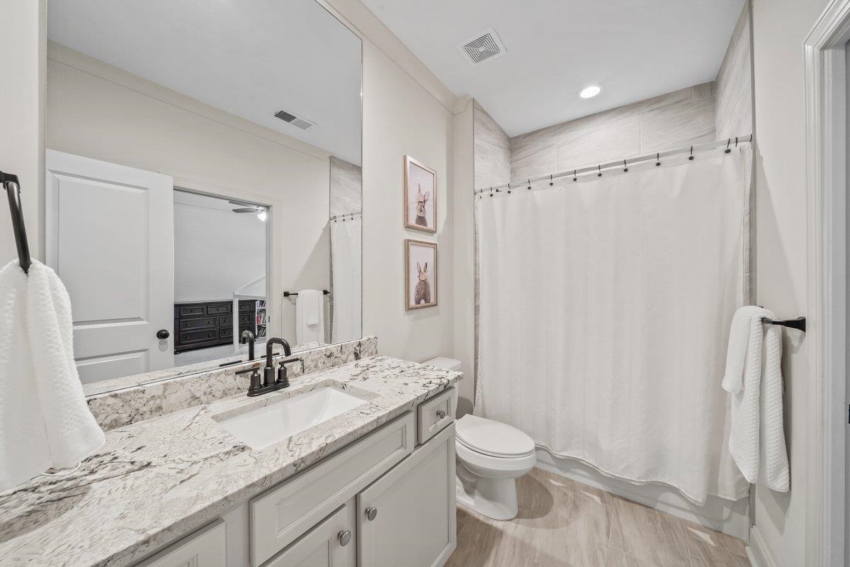 3358 Hidden Bend Lane Collierville, TN 38017 - Photo 26 of 32 a bathroom with a granite countertop sink toilet and shower