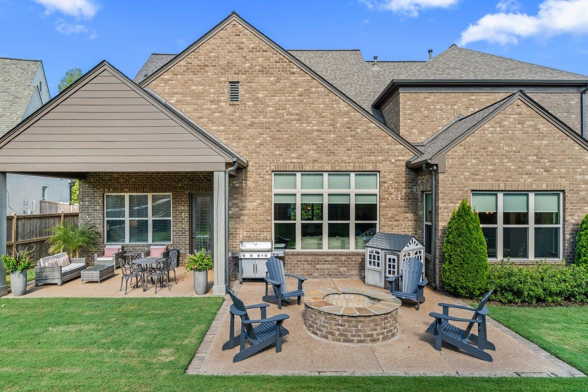 3358 Hidden Bend Lane Collierville, TN 38017 - Photo 30 of 32 a view of a house with backyard sitting area and garden