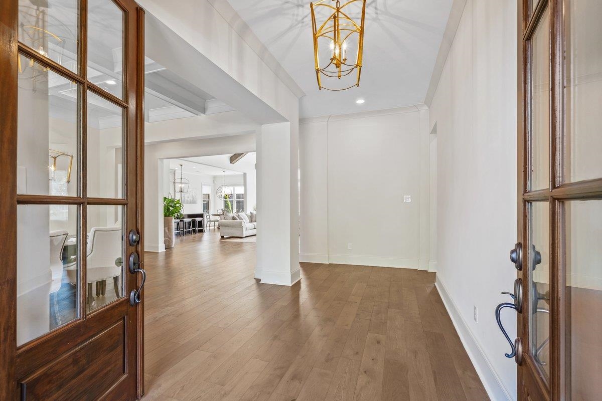 3358 Hidden Bend Lane Collierville, TN 38017 - Photo 5 of 32 wooden floor in an empty room with a window