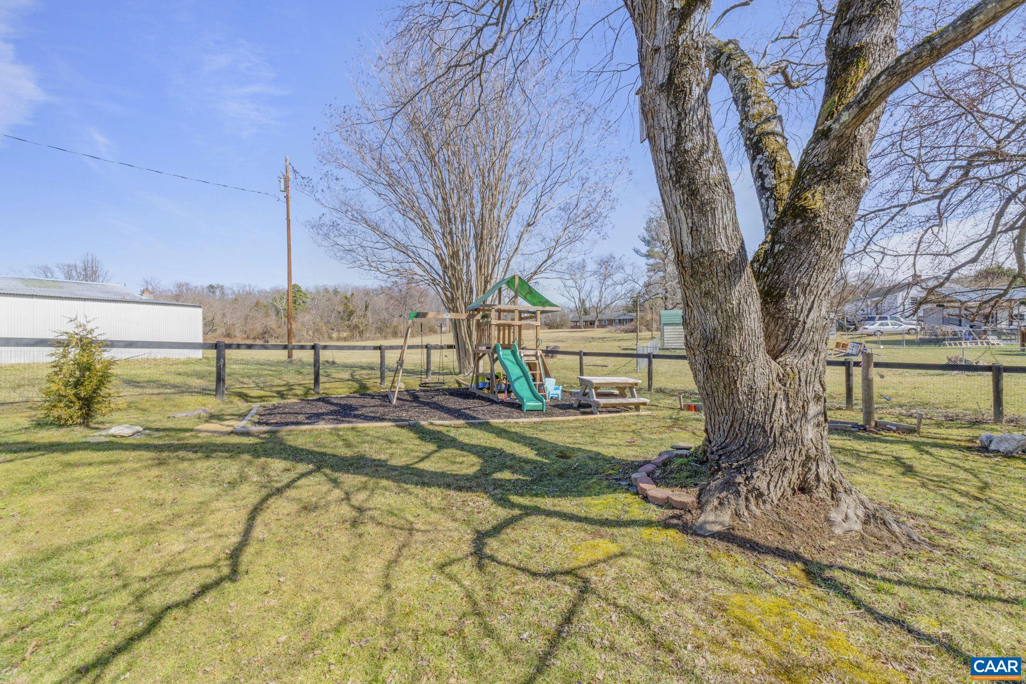 286 Madison Road Stanardsville, VA 22973 - Photo 38 of 48 a view of backyard with swimming pool and seating space