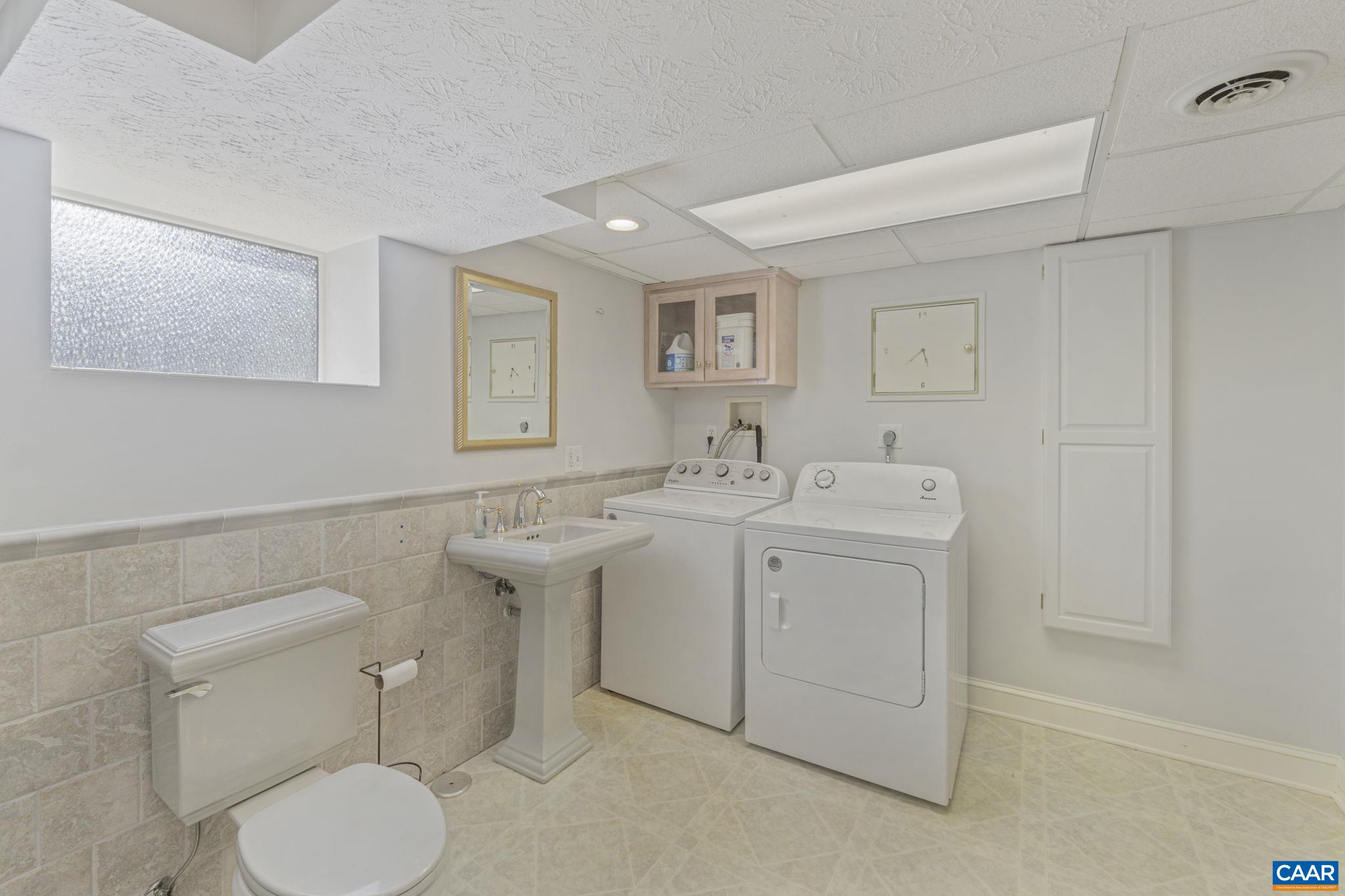 286 Madison Road Stanardsville, VA 22973 - Photo 44 of 48 a bathroom with a toilet sink and mirror