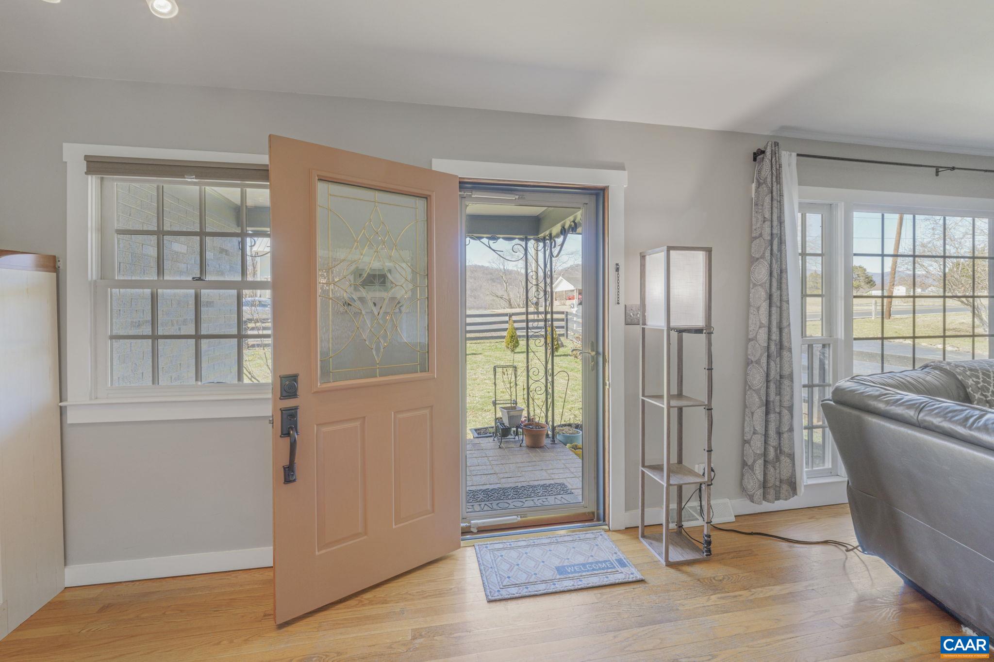 286 Madison Road Stanardsville, VA 22973 - Photo 8 of 48 a view of entryway with wooden floor and glass door