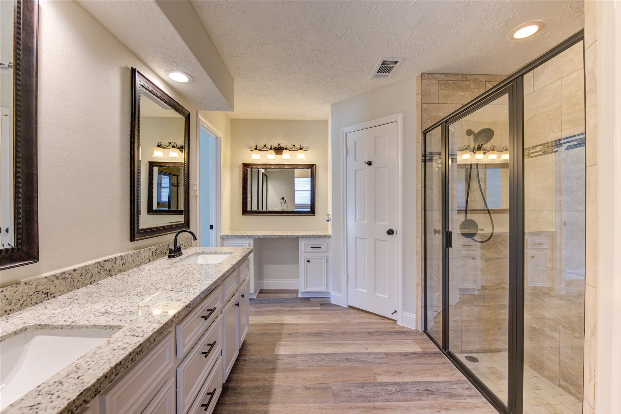 9115 Taidswood Drive Spring, TX 77379 - Photo 26 of 45 A view of the vanity area and the enclosed shower to the right.