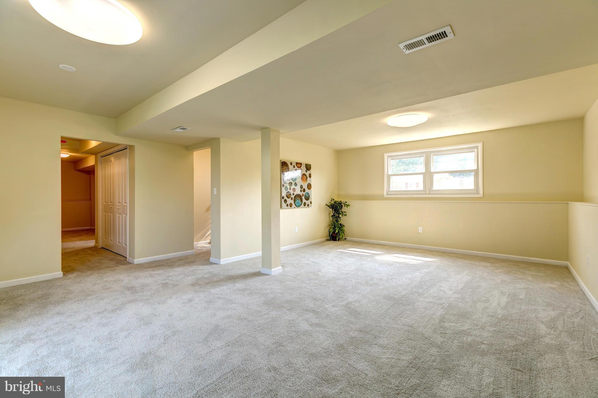 6711 Fox Meadow Road Baltimore, MD 21207 - Photo 21 of 30 a view of an empty room with a window